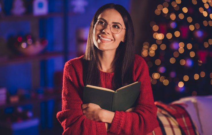 Woman hugging a book to her chest