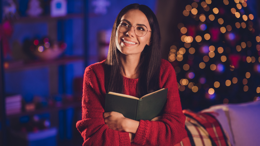 Woman hugging a book to her chest