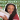 A YouTube thumbnail of a girl holding up a stack of books with the words "Romance books I love" behind her