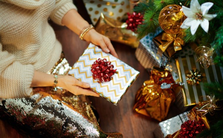 Person holding out a wrapped present