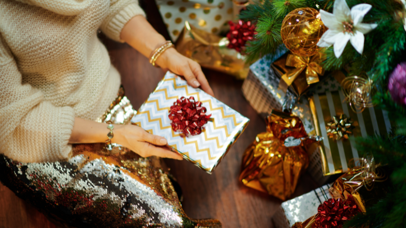 Person holding out a wrapped present