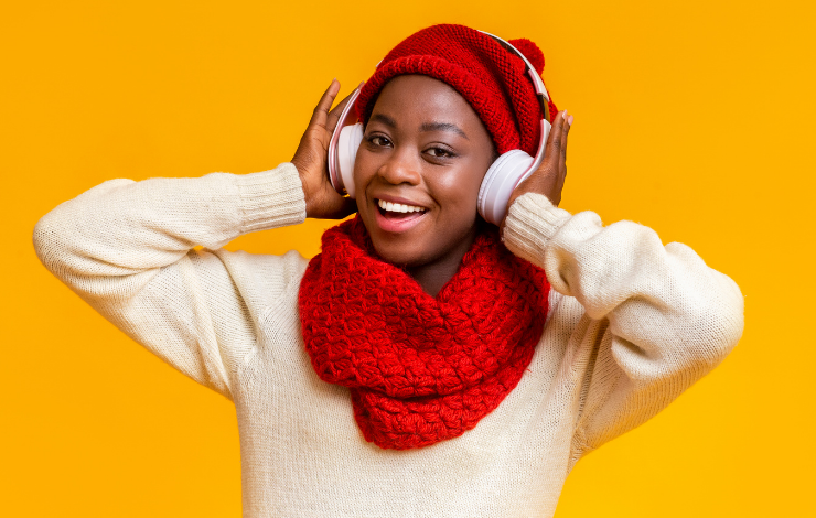 Person in winter clothes wearing headphones