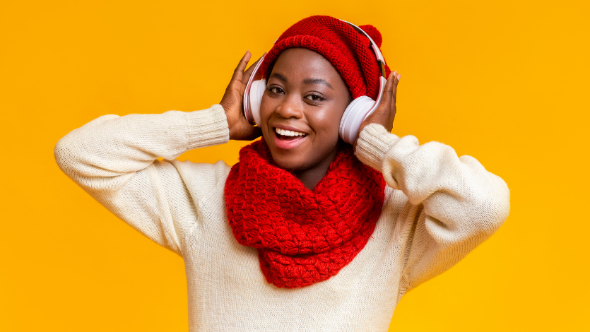 Person in winter clothes wearing headphones
