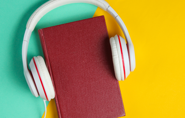Headphones around a book
