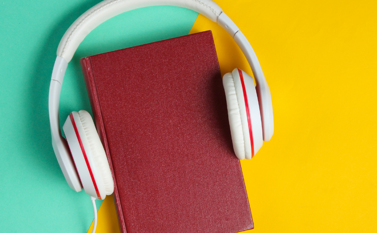 Headphones around a book