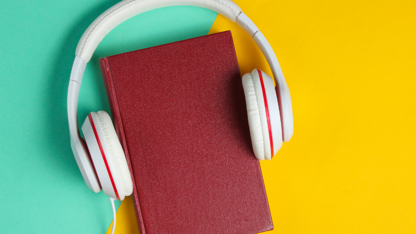 Headphones around a book