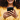 Hands holding up a phone with a partial view of a smiling face blurred in the background