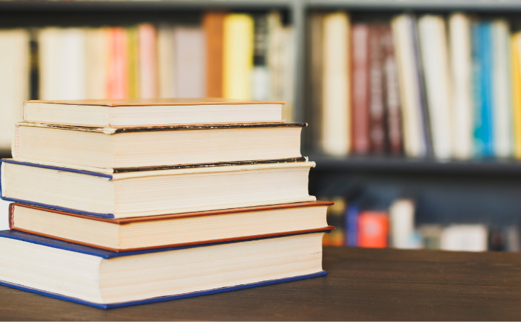 A stack of books sitting on a table