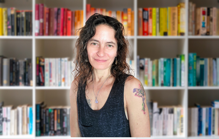 Photo of Alicia in front of a bookcase