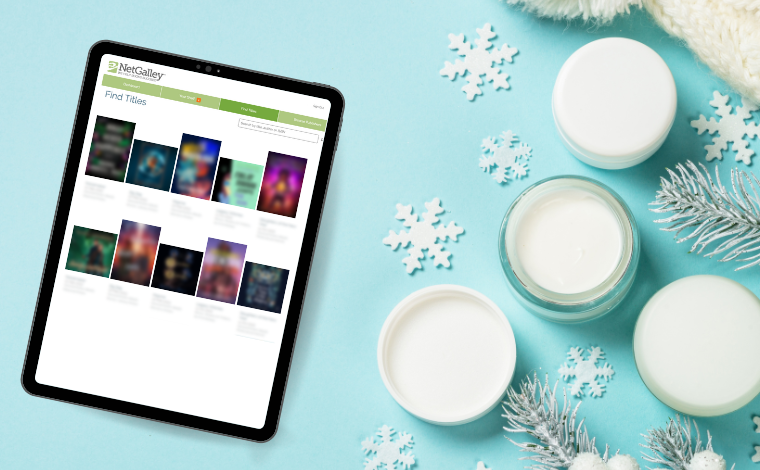 A winter flatlay of an iPad showing a NetGalley page with blurred books