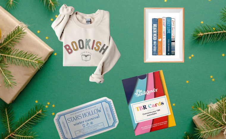 A flatlay showing a sticker, a sweatshirt, a pack of cards, and a picture in a frame