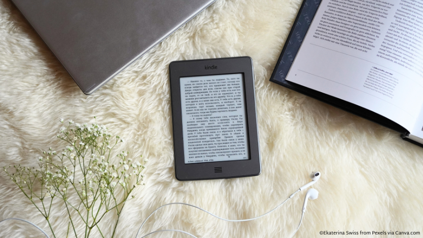 An e-reader on a white carpet