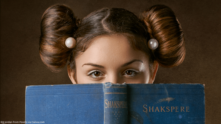 A girl looking over the top of an old book