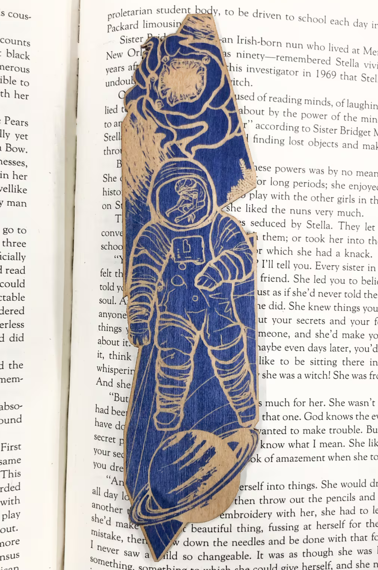 A wooden bookmark of an astronaut 