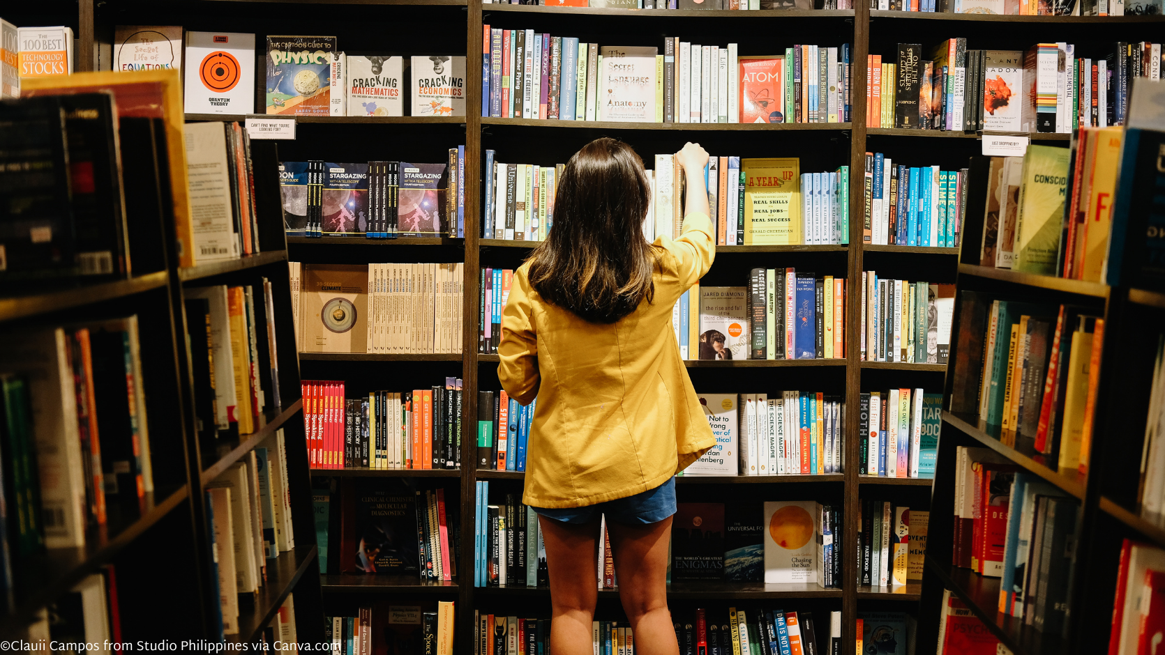 Woman reaching for book on shelf